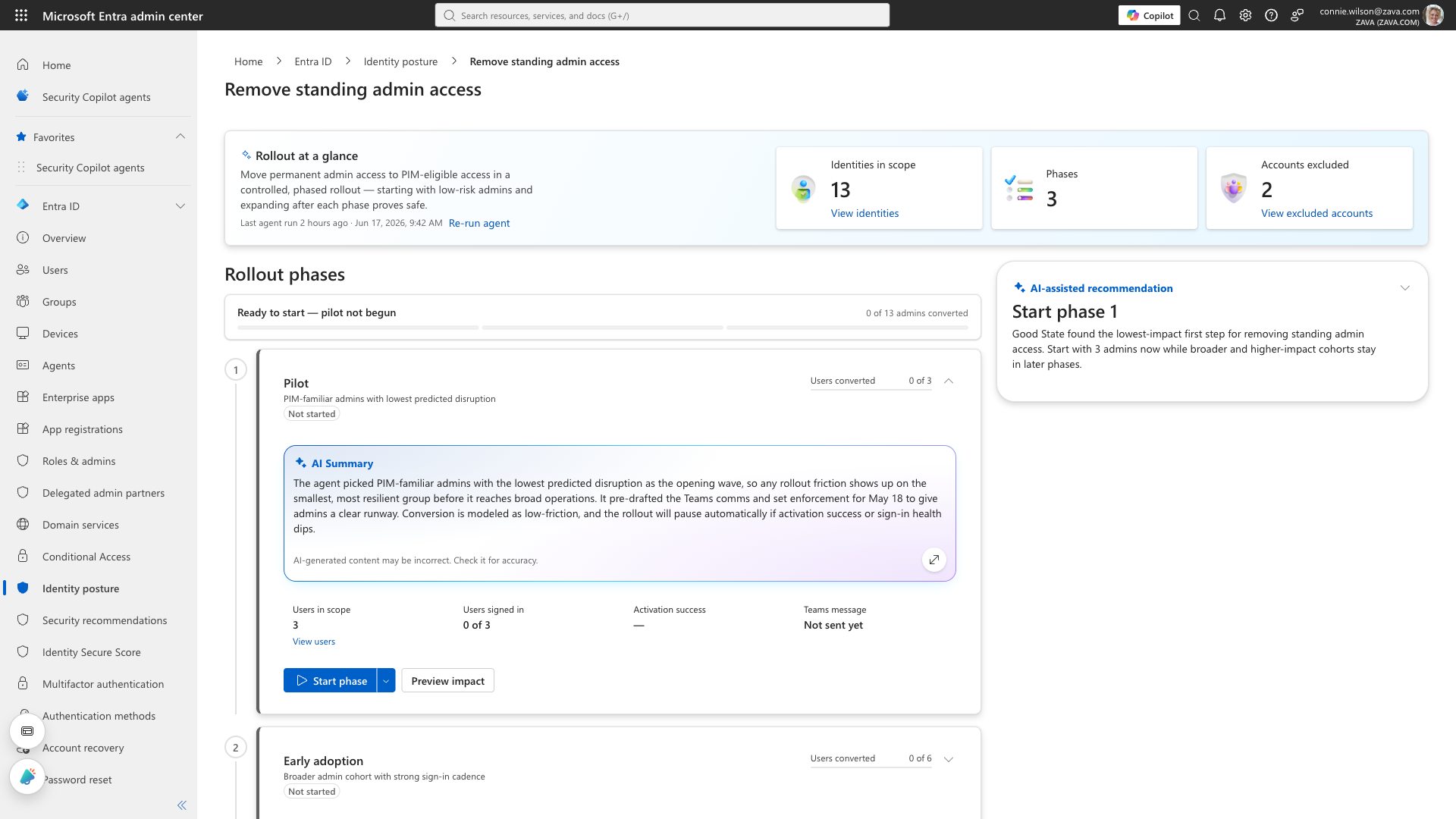 Phased PIM rollout: 13 identities in scope, 3 phases, 2 excluded, with Phase 1 pilot and an AI summary.